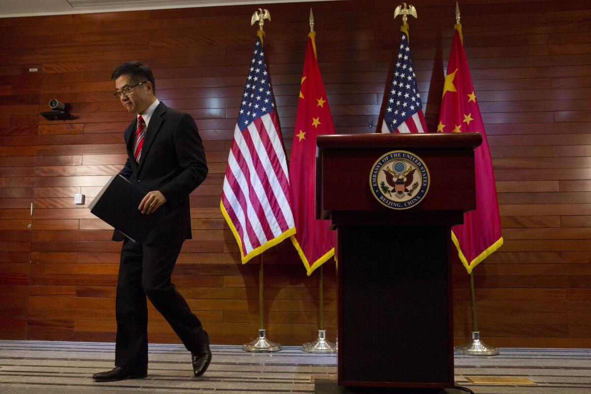 Outgoing U.S. Ambassador to China Gary Locke leaves after a farewell news conference Thursday at the U.S. Embassy in Beijing.