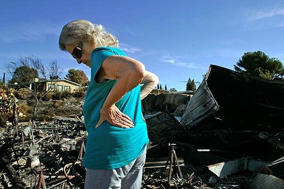 Darlene Westman surveys what is left of her mobile home at Sky Terrace Mobile Lodge, where she lived for 25 years.