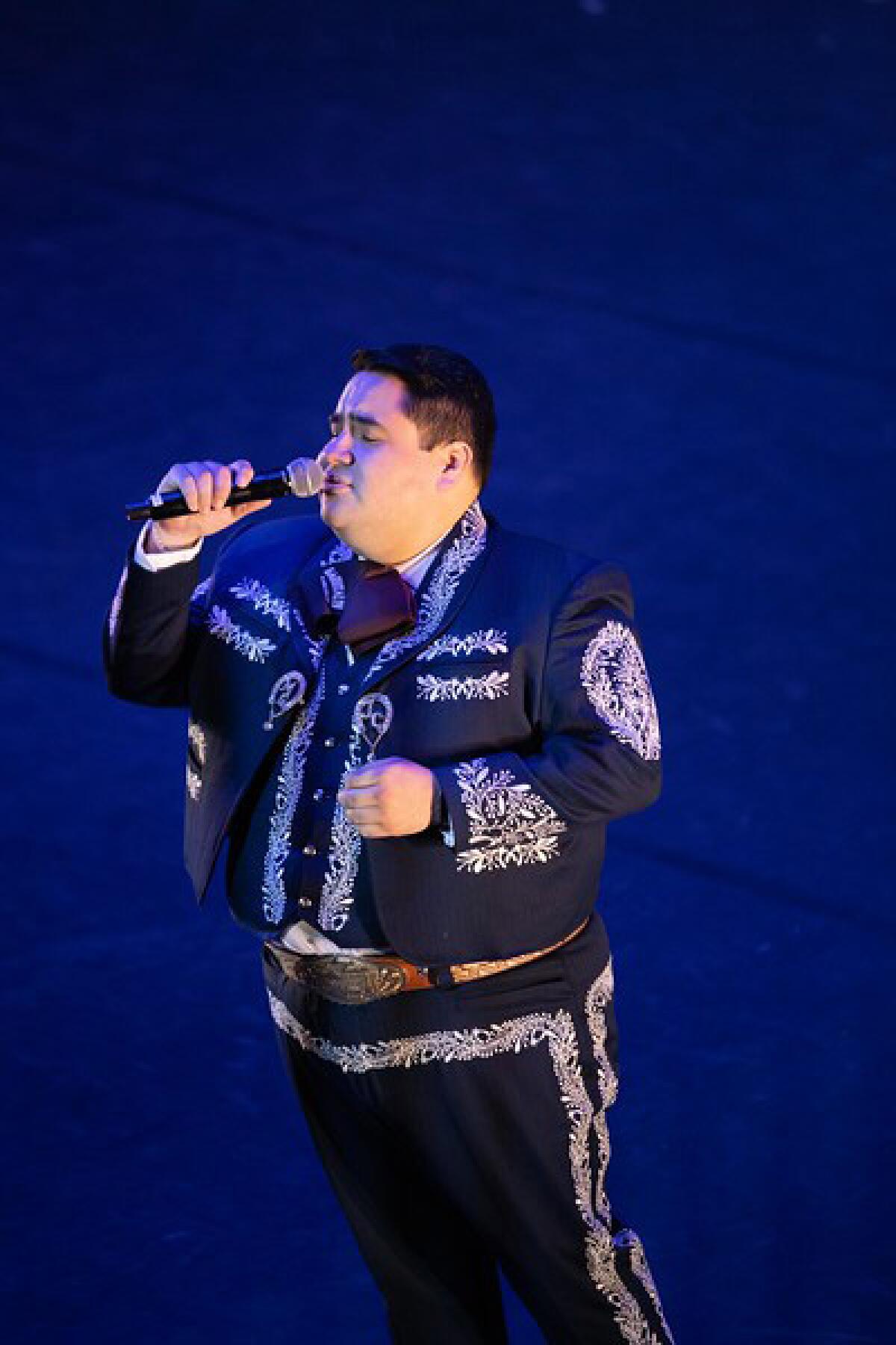 A soloist from Mariachi Garibaldi de Jaime Cuellar performs a song during the Nochebuena: 