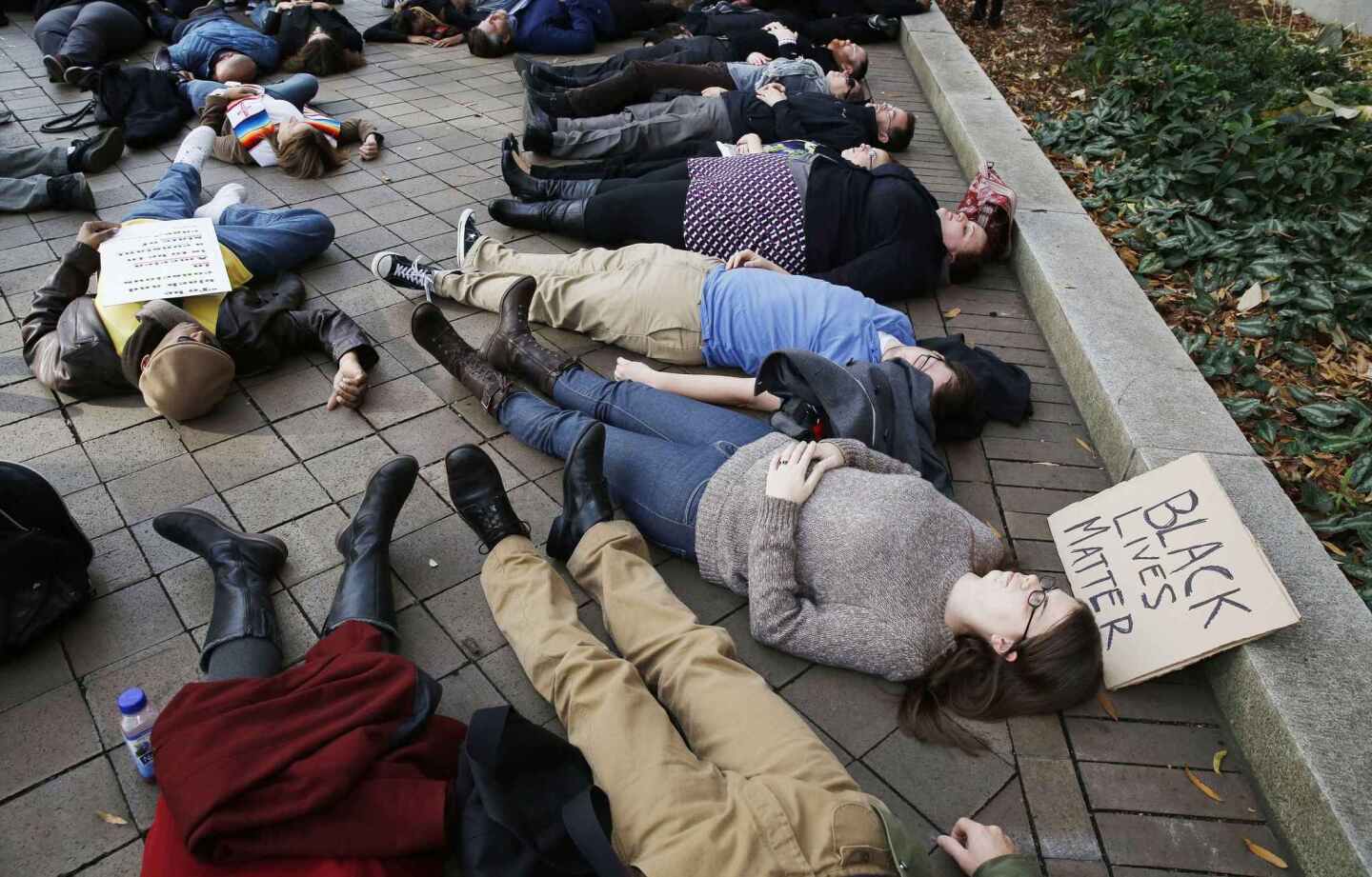 Demonstrators stage a "die-in" outside the Justice Department in Washington, D.C., to protest the grand jury's exoneration of Ferguson, Mo., police Officer Darren Wilson in the shooting death of Michael Brown, 18.
