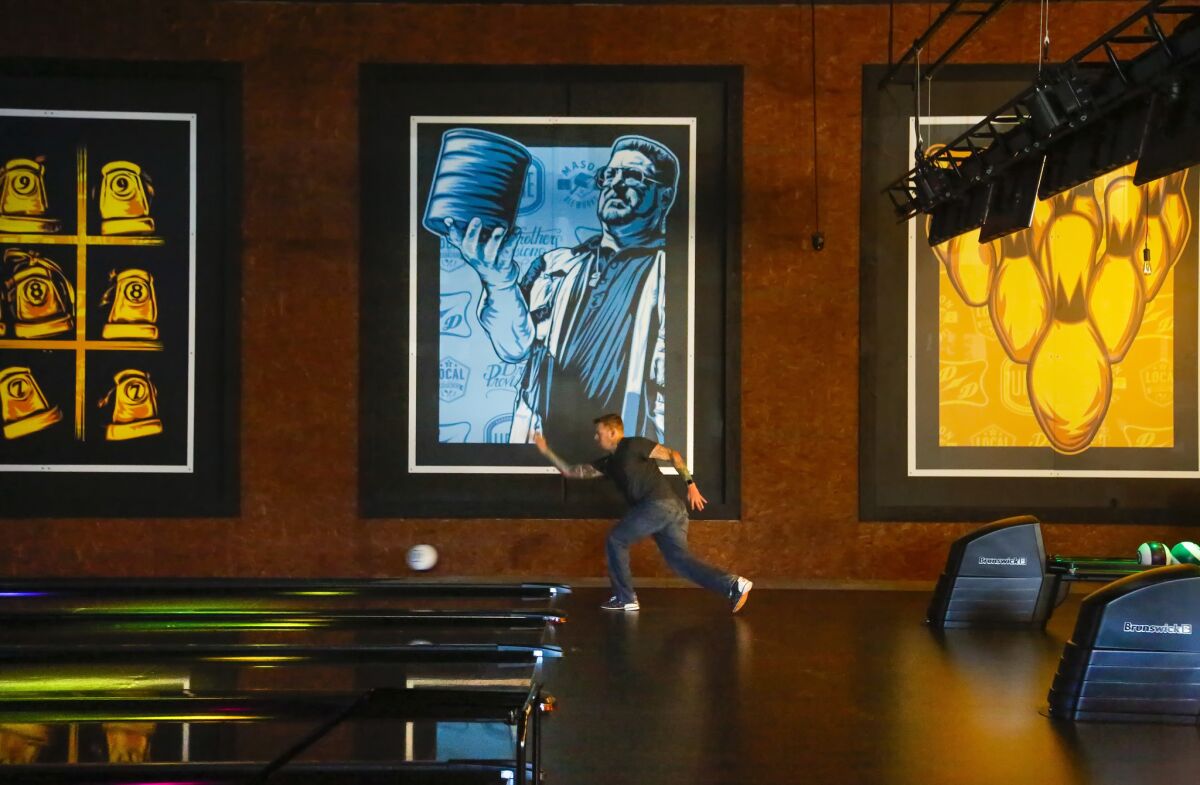 SAN MARCOS, CA: April 12, 2017 | Dan Cooper bowls at the 8-lane bowling alley inside the new Urge Gastropub and Common House near Cal State University San Marcos that features 21,000-square-feet of space which houses a Mason Ale Works brewery, restaurant, three bars and a large patio with bocce ball courts, and oversize table games. | Photo by Howard Lipin/San Diego Union-Tribune/Mandatory Credit: HOWARD LIPIN SAN DIEGO UNION-TRIBUNE/ZUMA PRESS