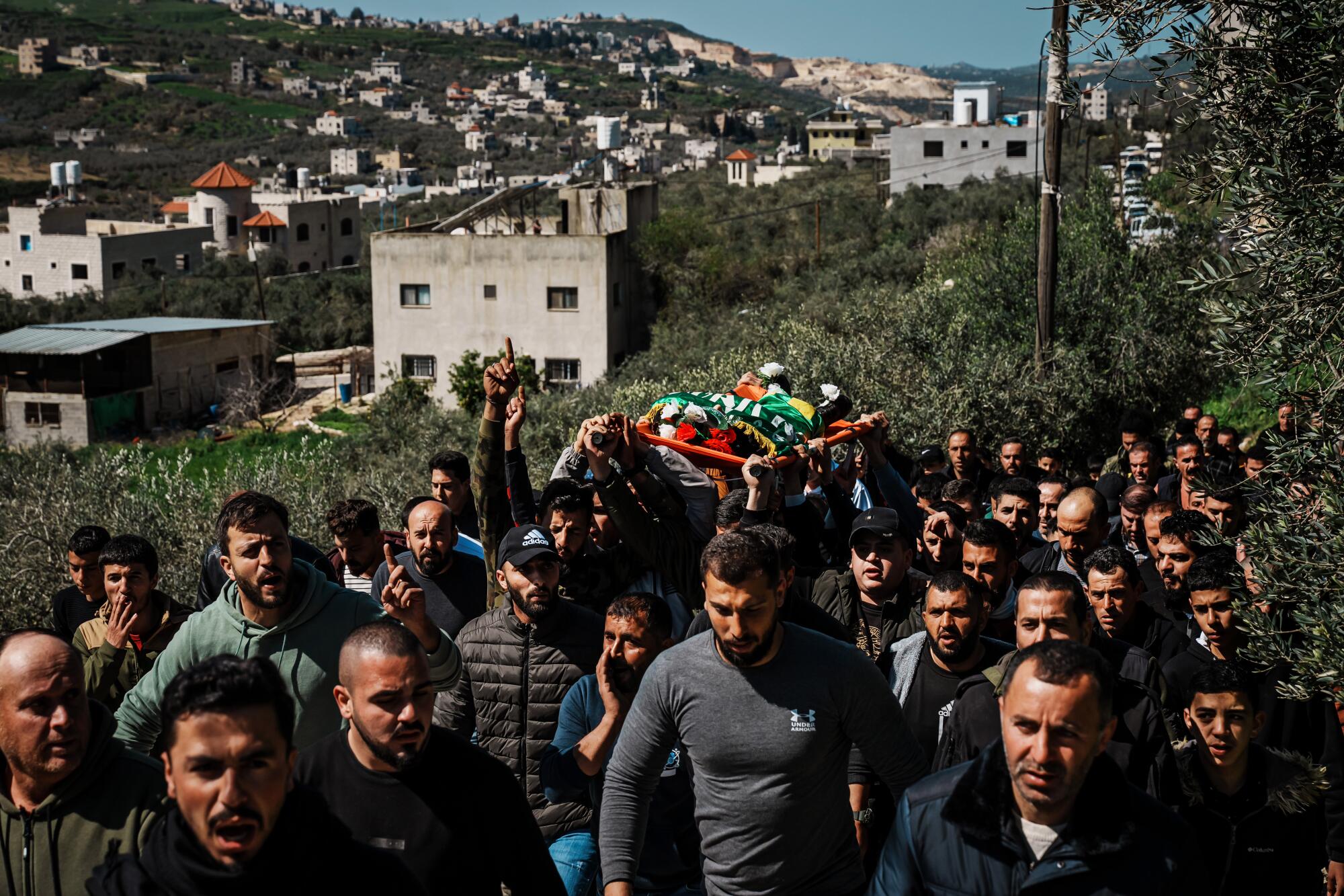 Community members and relatives attend a funeral procession for Amro Najjar, 10, who was killed by Israeli forces.