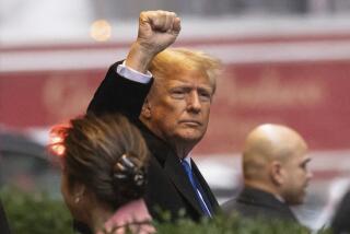 Former President Donald Trump raises his fist as he leaves his apartment building, Thursday, Jan 25, 2024, in New York. (AP Photo/Yuki Iwamura)