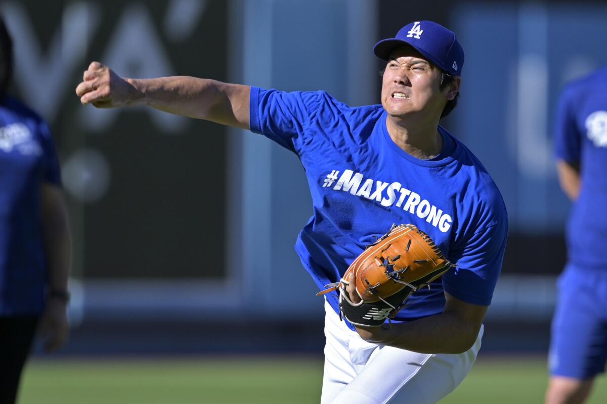 Shohei Ohtani throws in the outfield prior to a game last month.