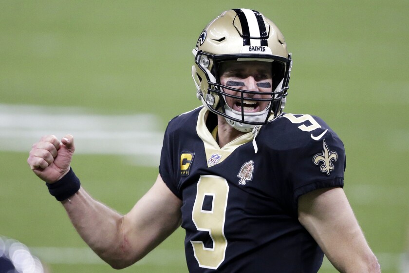 New Orleans Saints quarterback Drew Brees (9) reacts after a touchdown by Alvin Kamara in the second half of an NFL wild-card playoff football game against the Chicago Bears in New Orleans, Sunday, Jan. 10, 2021. (AP Photo/Butch Dill)