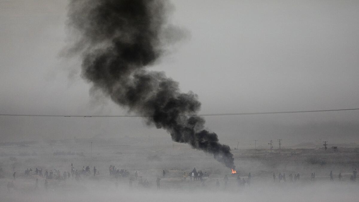 Smoke from Israeli tear gas fills the air during clashes near the border in the east of Gaza City, Gaza Strip on Dec. 27.