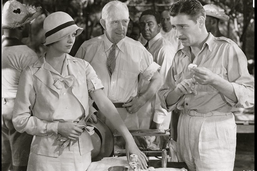 Ronald Colman (right) as Martin Arrowsmith prepares to fight a plague outbreak in the Caribbean as Myrna Loy and Alec B. Francis watch in the 1931 film version of the Sinclair Lewis novel.