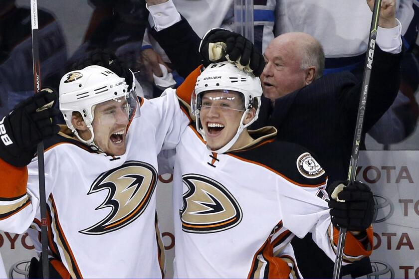 Anaheim Ducks' Tomas Fleischmann, left, and Rickard Rakell celebrate a goal against the Winnipeg Jets during the third period of Game 4 of a first-round of the Stanley Cup playoffs on Wednesday. Anaheim won 5-2 and swept the series.