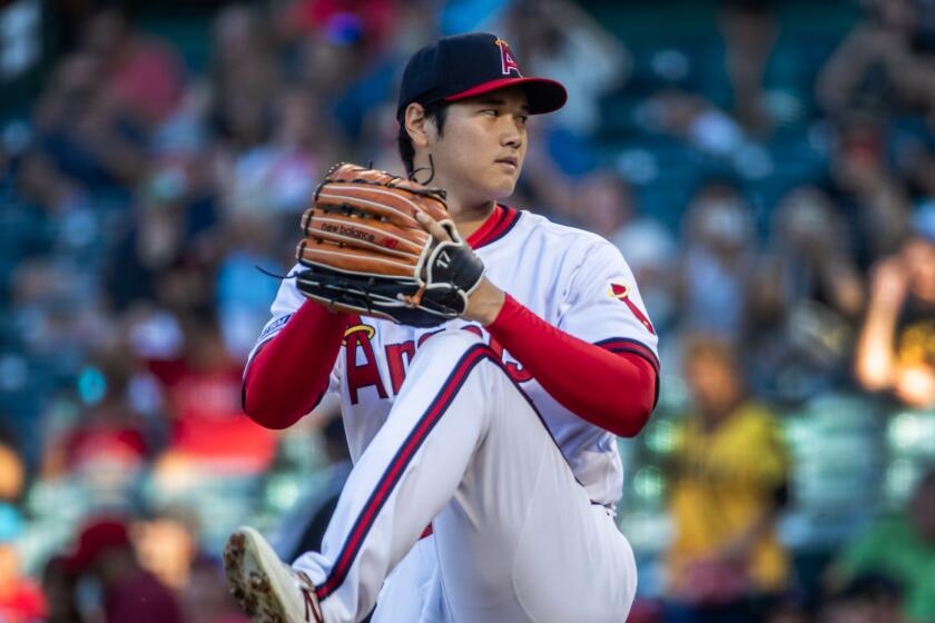 Angels starting pitcher and two-way player Shohei Ohtani delivers a pitch against the Pittsburgh Pirates on July 21, 2023.