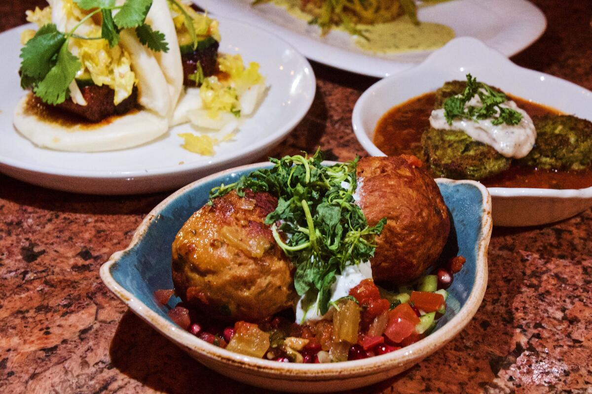 A selection of small plates from Carthay Circle, including large chicken meatballs with pomegranate relish and tzatziki