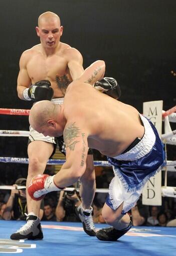 Tom Zbikowski knocks out Richard Bryant in their heavyweight bout at the MGM Grand in Las Vegas.