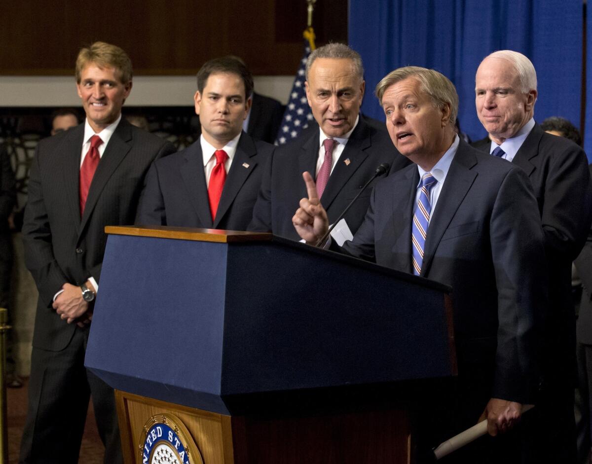 Sen. Lindsey Graham (R-S.C.) speaks about the immigration bill in April. With him are, from left, Sens. Jeff Flake (R-Ariz.), Marco Rubio (R-Fla.), Charles E. Schumer (D-N.Y.) and John McCain (R-Ariz.).
