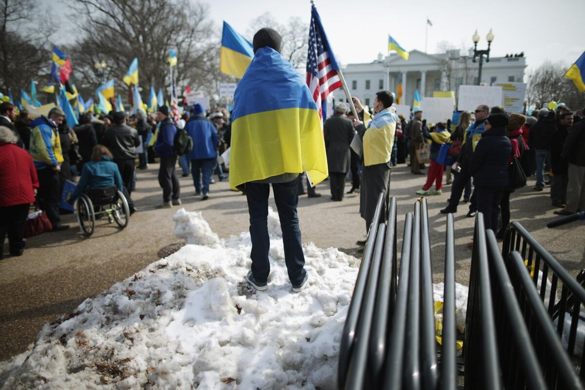 Demonstrators rally Thursday outside the White House in Washington to protest Russia's military incursion in Ukraine.