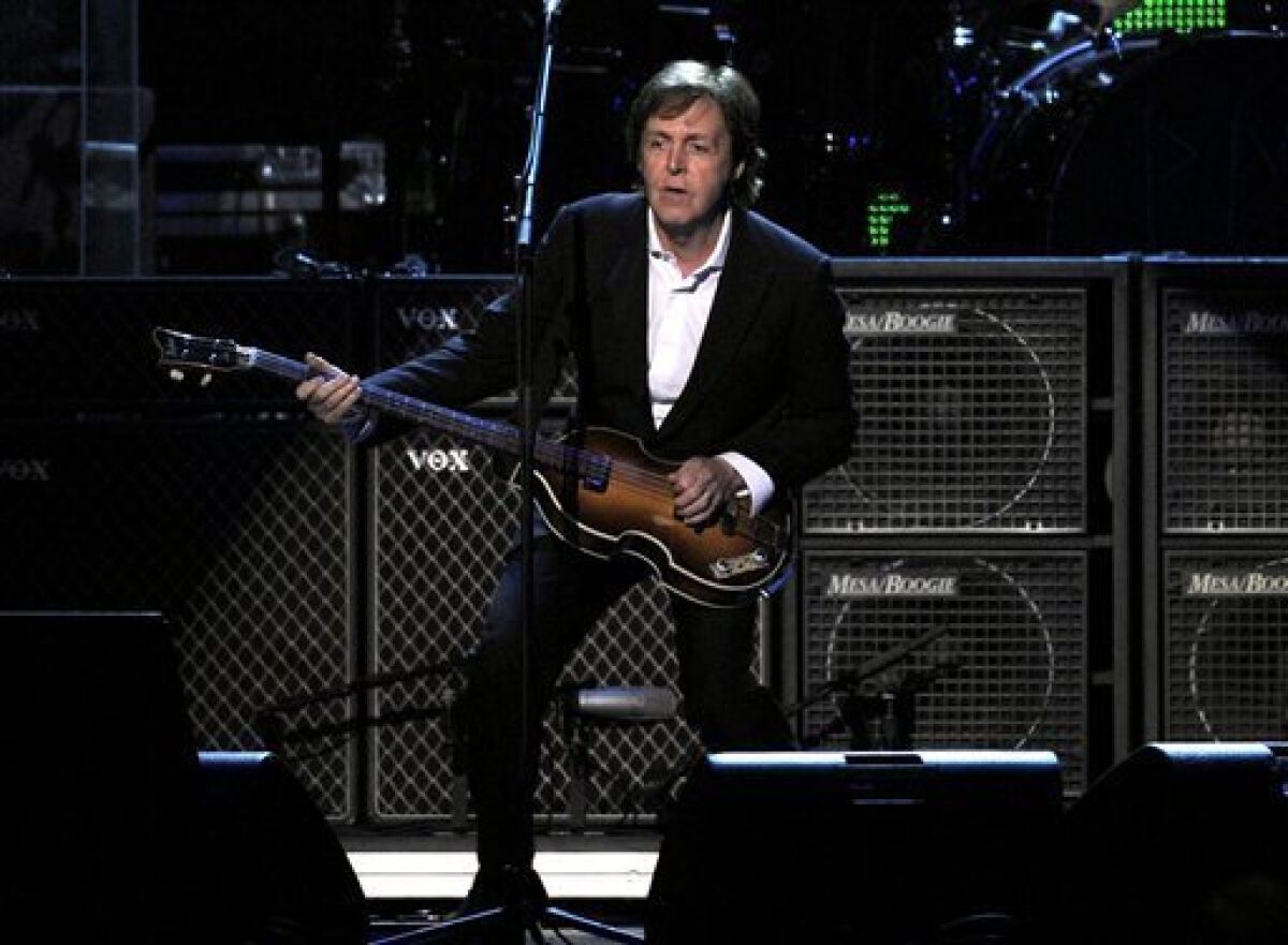 Paul McCartney performs at the MusiCares Person of the Year gala in his honor on Friday, Feb. 10, 2012 in Los Angeles. (AP Photo/Chris Pizzello)