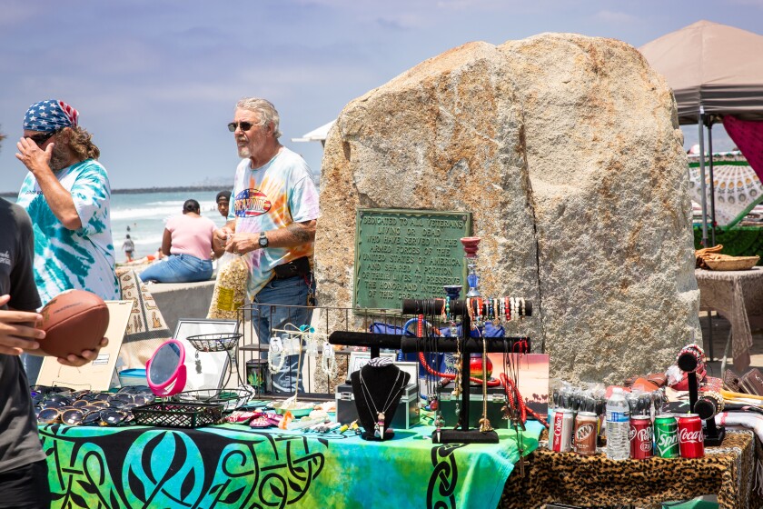 Vendors' tables surround the veterans monument at Ocean Beach Veterans Plaza recently.