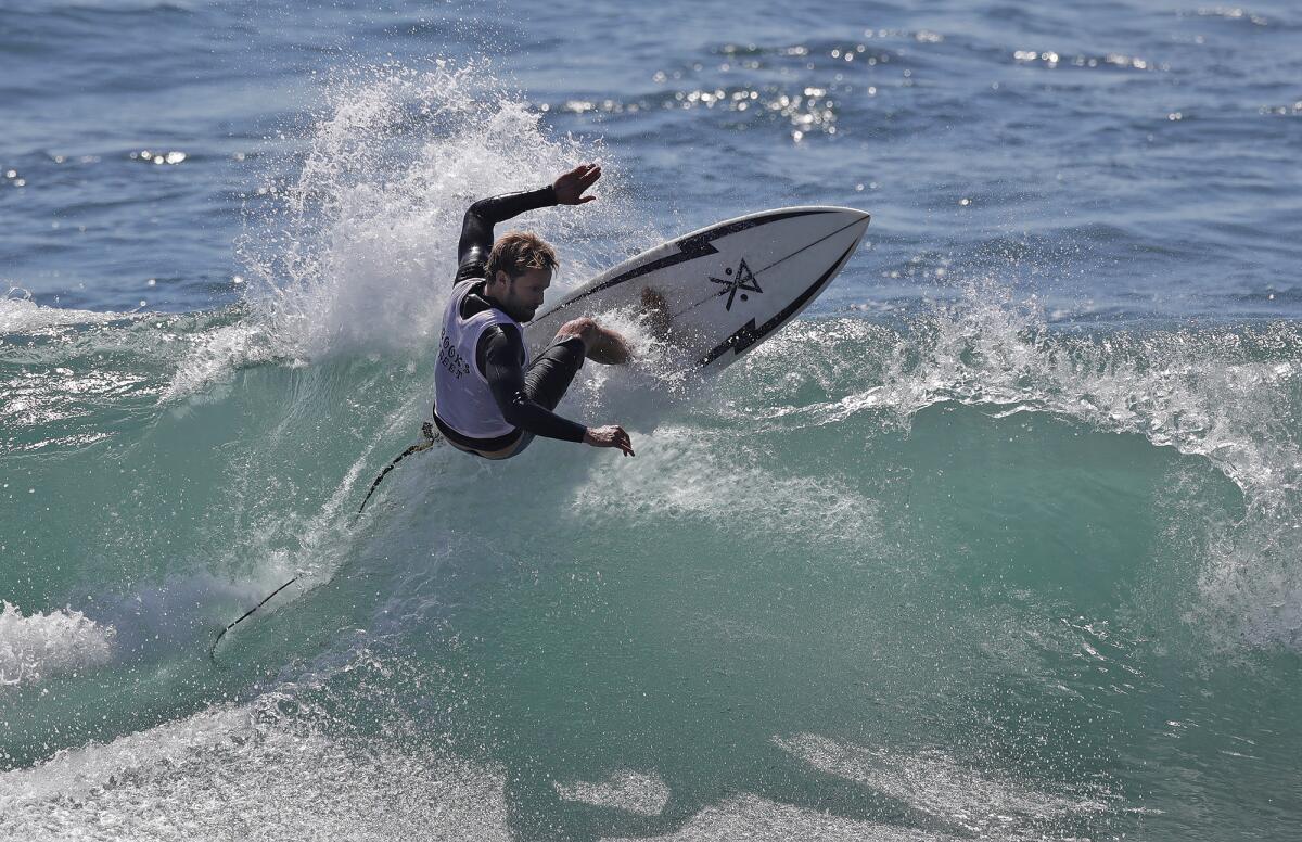 Eli Viszolay carves off the top of a wave in the 56th annual Brooks Street Surfing Classic.