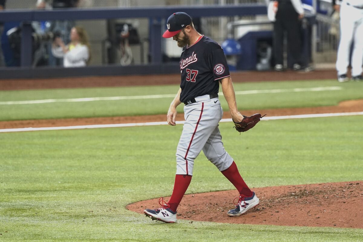 Washington Nationals starting pitcher Stephen Strasburg (37) leaves the mound in the fifth inning of a baseball game against the Miami Marlins, Thursday, June 9, 2022, in Miami. (AP Photo/Marta Lavandier)