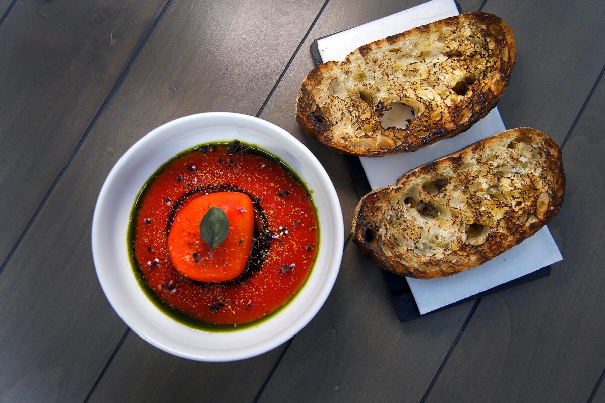 Here's the smoked mozzarella dressed up like a tomato, with pomodomo sauce with grilled bread.