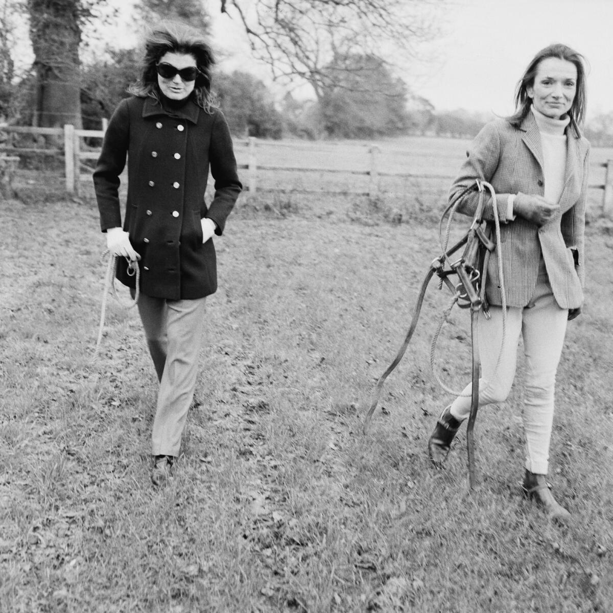 Jacqueline Kennedy Onassis with Lee Radziwill at a horse farm in Britain in November 1968.