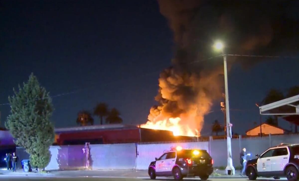 A deadly fire ripped through a building in South Los Angeles early Saturday morning
