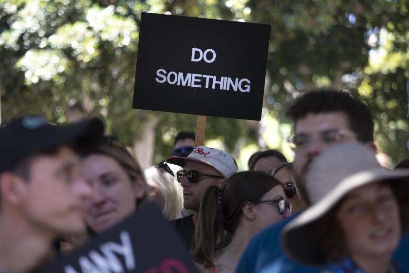 Los Angeles, CA - June 11: Participants listen to speakers during March for our Lives against gun violence downtown on Saturday, June 11, 2022 in Los Angeles, CA. (Brian van der Brug / Los Angeles Times)