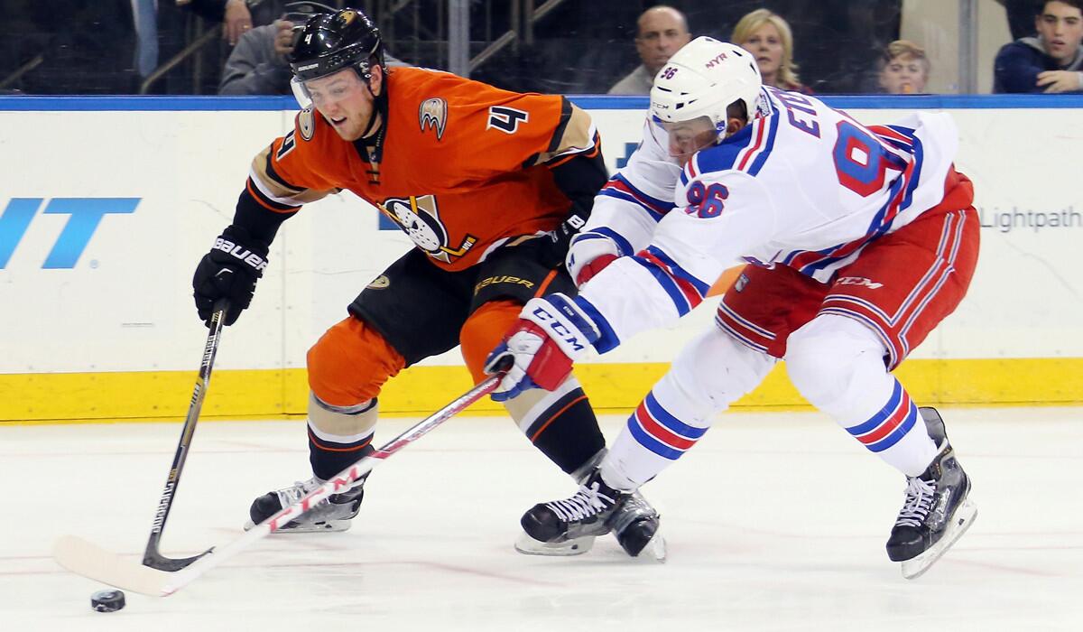 New York Rangers' Emerson Etem, right, and Anaheim Ducks' Cam Fowler pursue the puck during the second period on Dec. 22.