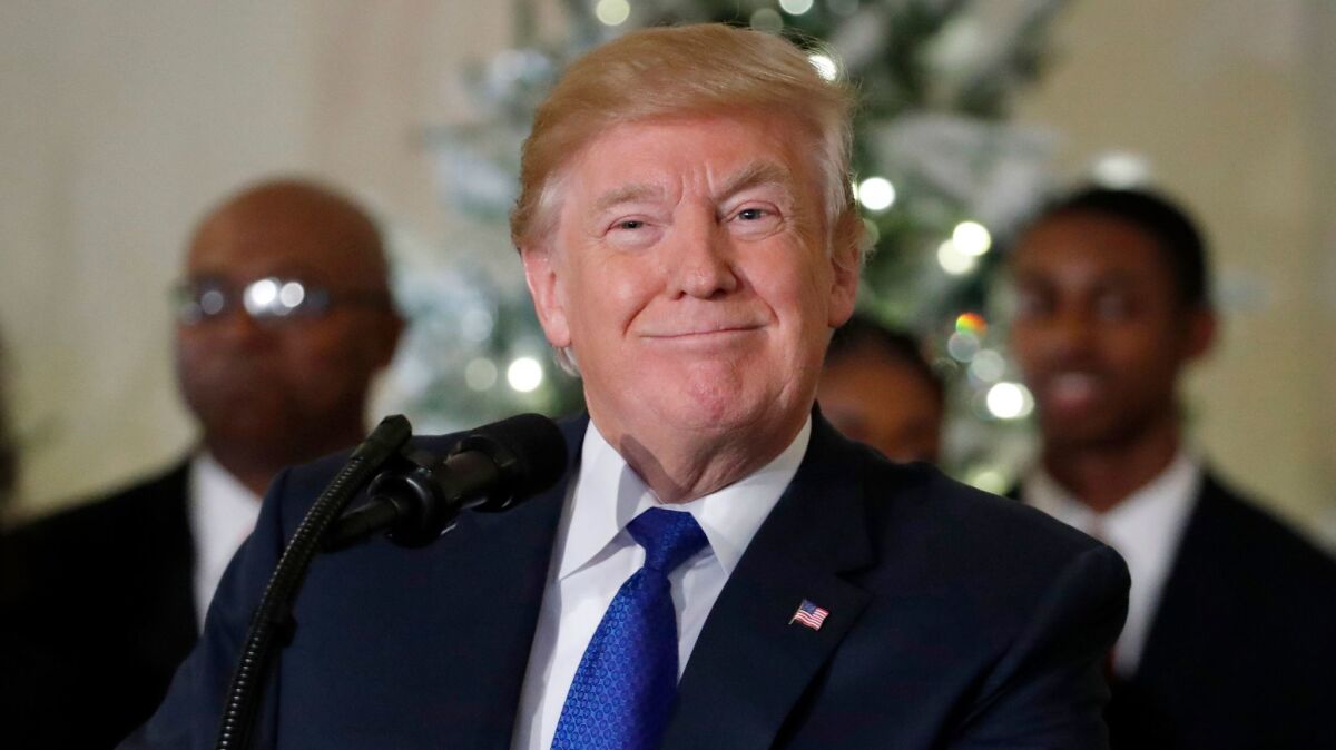 President Donald Trump smiles while speaking about tax reform in the Grand Foyer of the White House, Wednesday, Dec. 13, 2017, in Washington. (AP Photo/Alex Brandon)