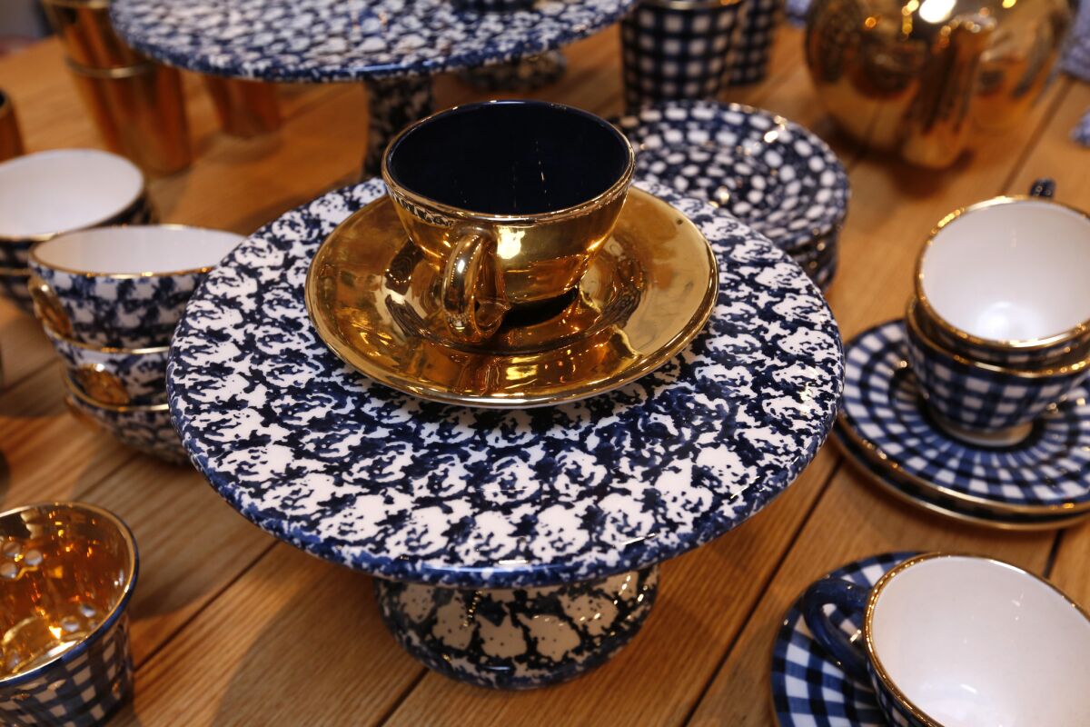 Hand-painted ceramic plates and cups ($41.00-$375.00) from Poland are available at EnSoie.