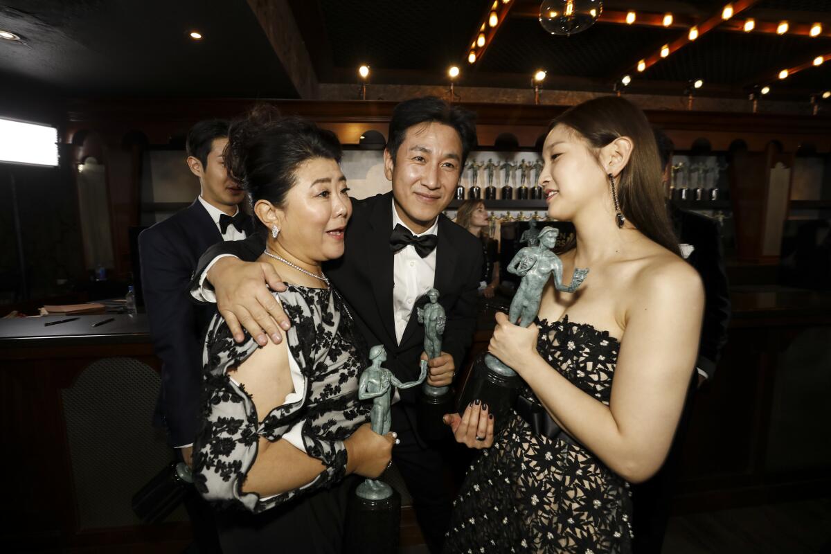 Lee Sun Kyun, center left, with fellow "Parasite" cast members