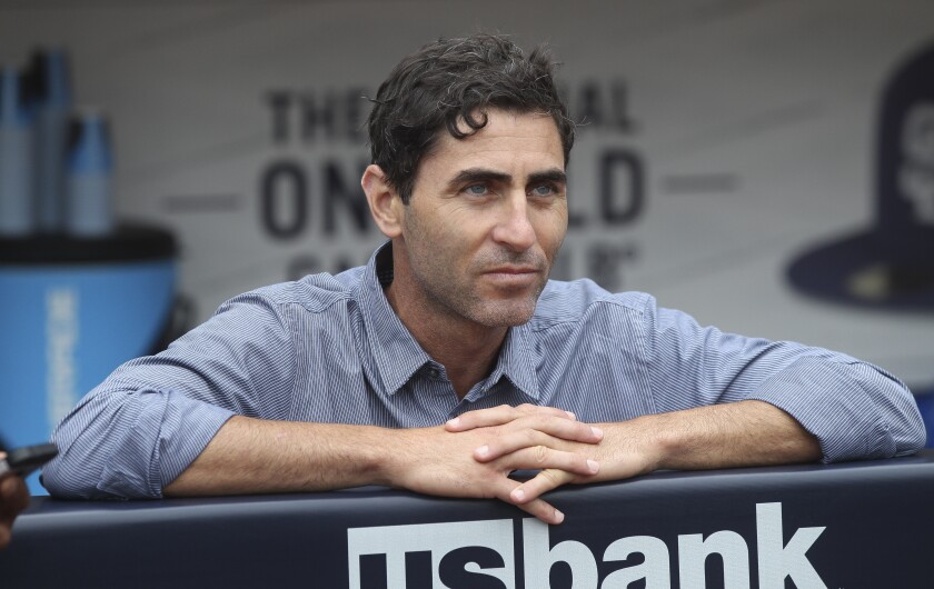 Padres General Manager A.J. Preller, shown June 6 at Petco Park, is weighing trade options that include pitchers Noah Syndergaard and Trevor Bauer.