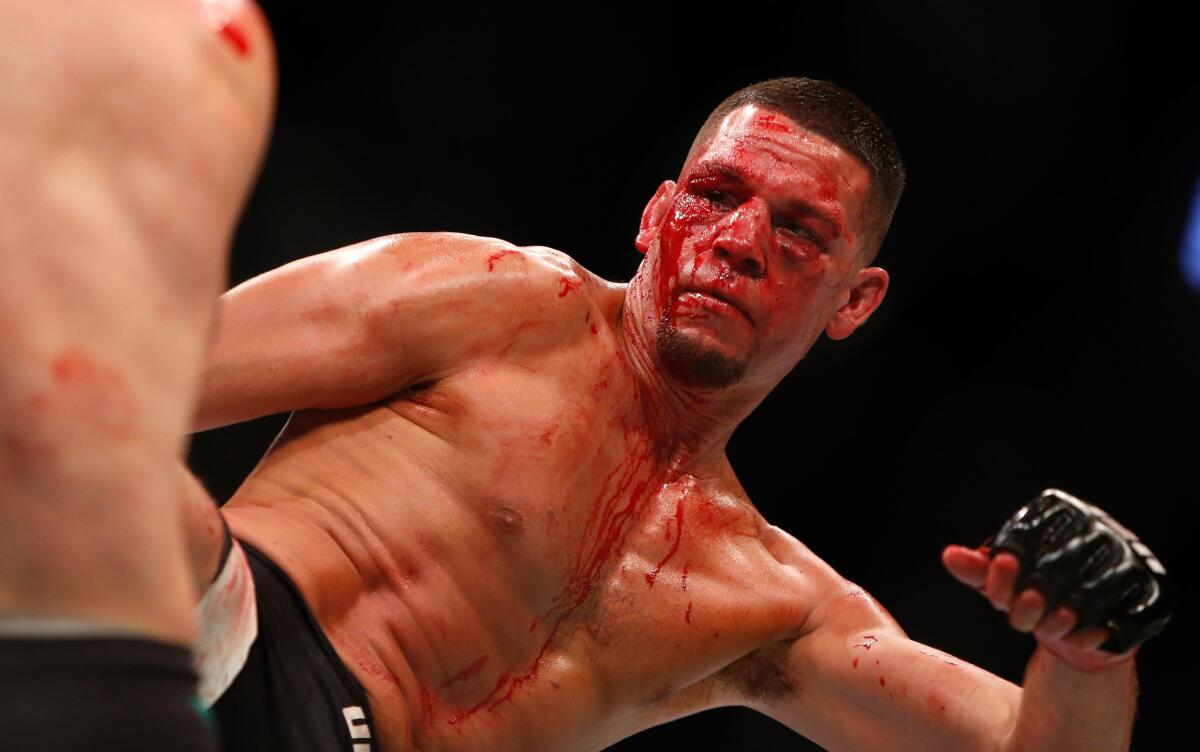 Nate Diaz kicks attempts a kick during his welterweight bout against Conor McGregor on Aug. 20, 2016.