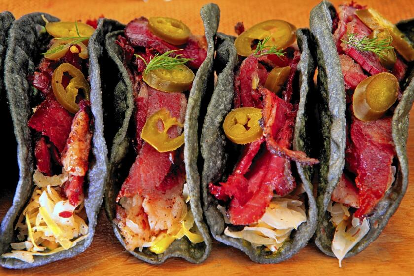 Pastrami tacos made with blue-corn tortillas.