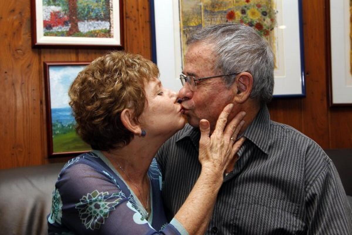 Tami Warshel kisses her husband, USC chemist Arieh Warshel, at their home in Los Angeles after he was awarded the Nobel Prize in chemistry. Warshel shares the prize with Michael Levitt of Stanford and Martin Karplus of Harvard.