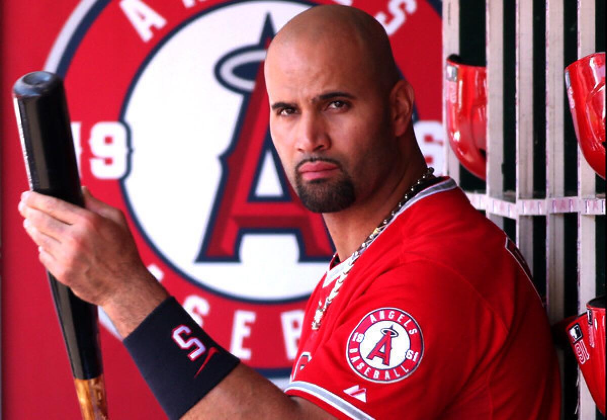 Angels slugger Albert Pujols awaits his turn to bat during the game against the Tiger on Sunday.
