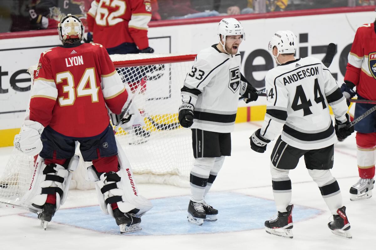 The Kings' Viktor Arvidsson (33) and Mikey Anderson celebrate Arvidsson's goal against Florida Panthers goalie Alex Lyon.