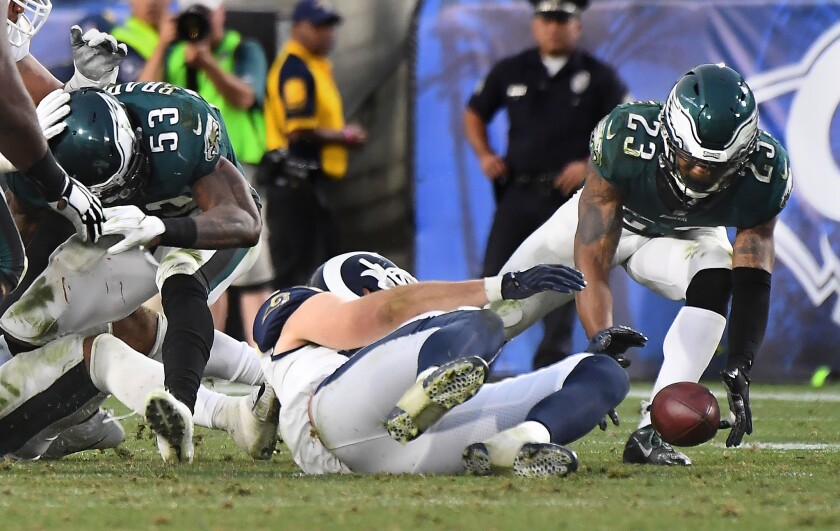 Eagles safety Rodney McLeod picks up a fumble by Rams quarterback Jared Goff (not pictured) in the 4th quarter.