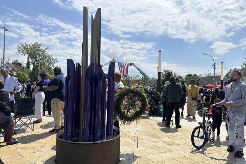 A sculpture entitled Unity was unveiled as the city marked the second anniversary of a racist mass shooting that killed 10 shoppers and employees at a Tops supermarket on Tuesday, May 14, 2024, in Buffalo, N.Y. The sculpture is part of the newly constructed 5/14 Tops Honor Space in front of the store. (AP Photo/Carolyn Thompson)