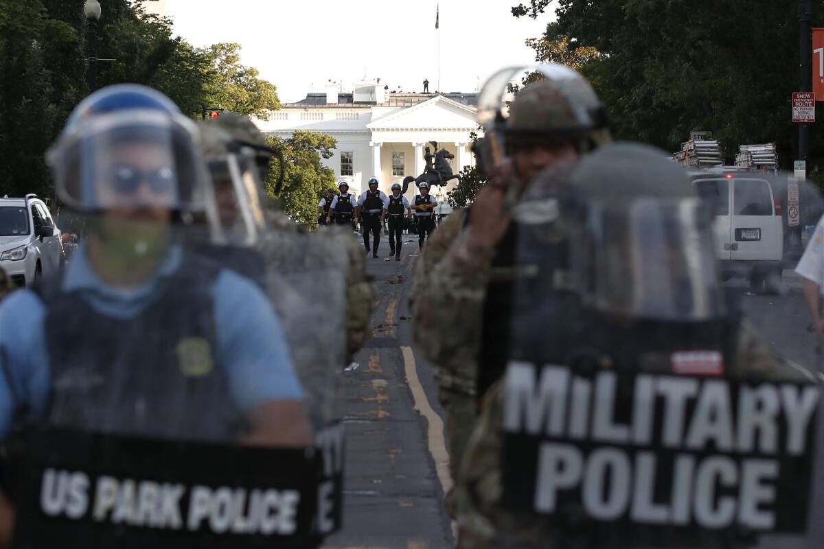 Federal police clear the area around Lafayette Square and the White House in Washington on June 1. 