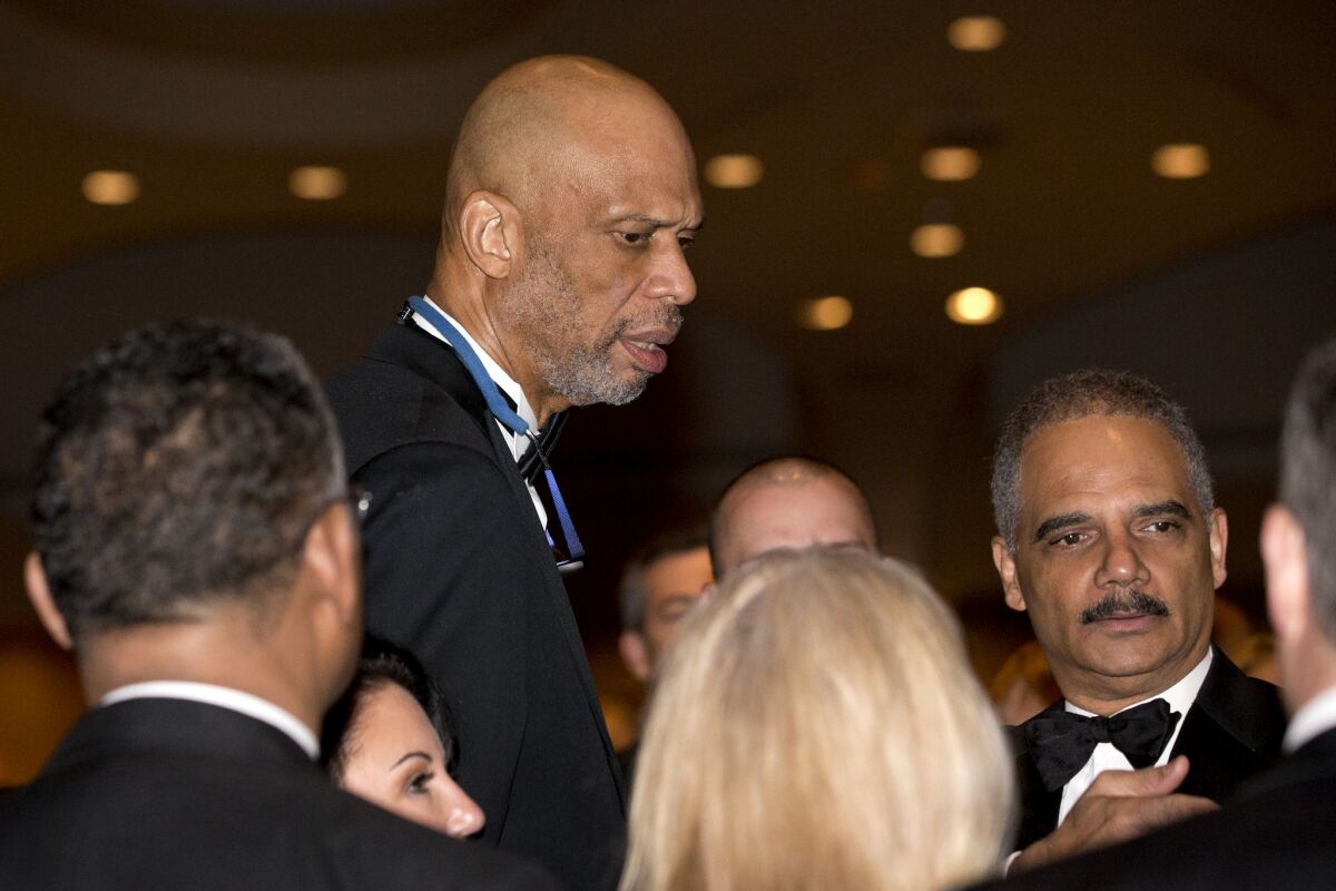 Kareem Abdul-Jabbar with Atty. Gen. Eric H Holder Jr. at the White House Correspondents' Assn. Dinner in Washington on May 3.