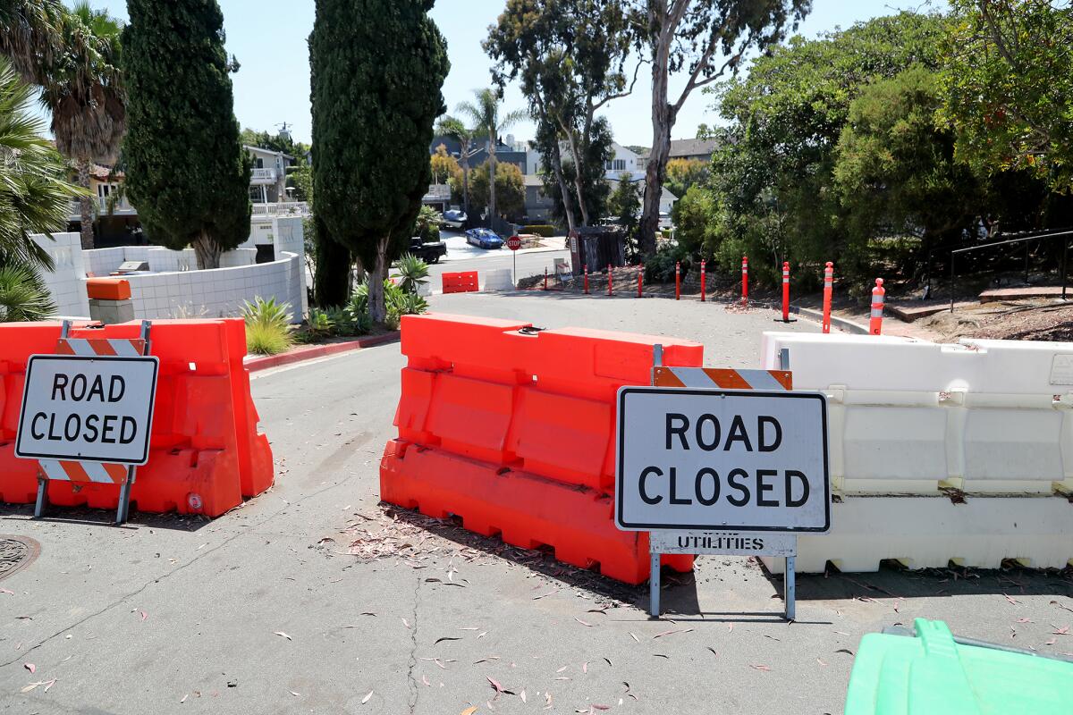 Temporary barricades block access along Ocean View Avenue at Tustin Avenue on June 29.