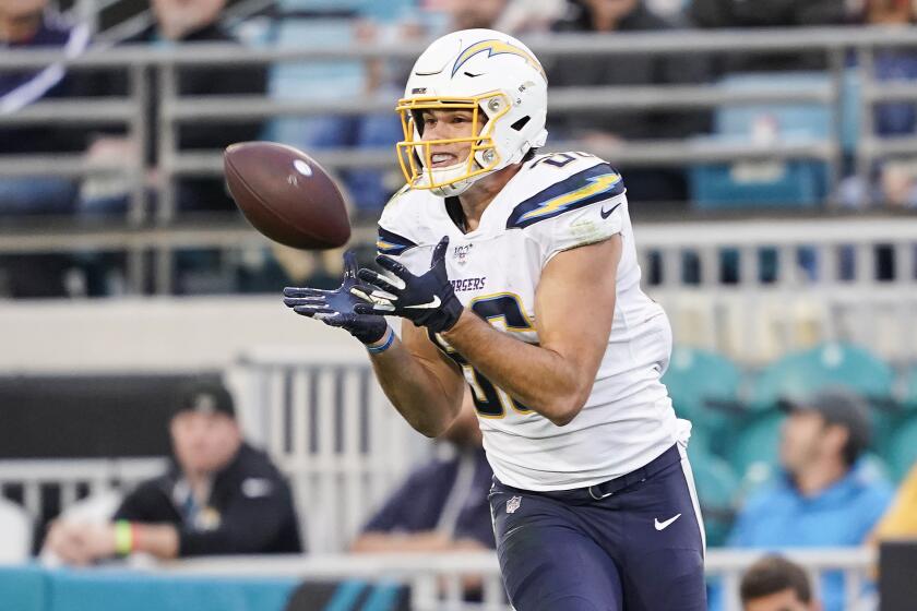 JACKSONVILLE, FLORIDA - DECEMBER 08: Hunter Henry #86 of the Los Angeles Chargers catches a pass for a touchdown during the second quarter of a game against the Jacksonville Jaguars at TIAA Bank Field on December 08, 2019 in Jacksonville, Florida. (Photo by James Gilbert/Getty Images)