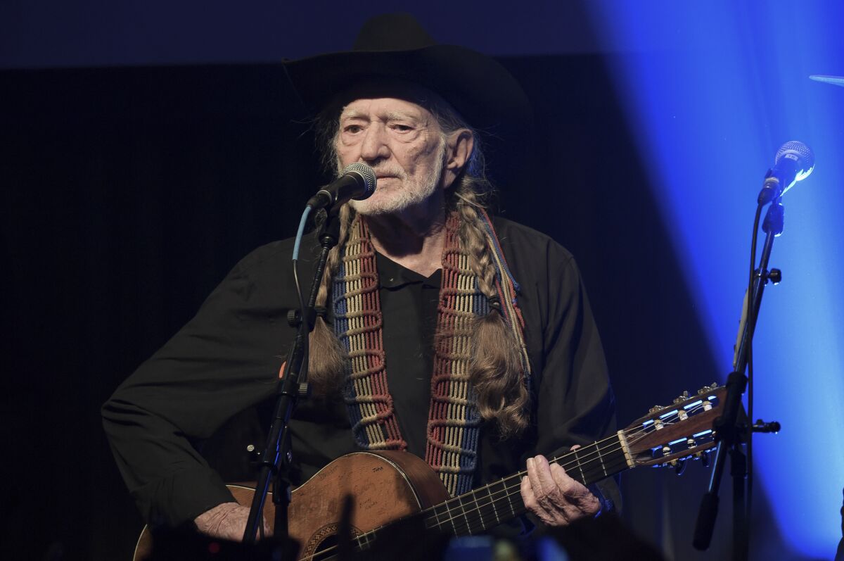 FILE - Willie Nelson performs at the Producers & Engineers Wing 12th Annual Grammy Week Celebration at the Village Studio in Los Angeles, on Feb. 6, 2019. Weeks after winning more Grammys, Nelson is getting a new kind of honor: a university endowment in Texas. The 89-year-old country music icon, who in the 1980s helped launch the Farm Aid benefit concerts, is the namesake of the new Willie Nelson Endowment for Uplifting Rural Communities at the University of Texas’ LBJ School of Public Affairs. (Photo by Richard Shotwell/Invision/AP, File)