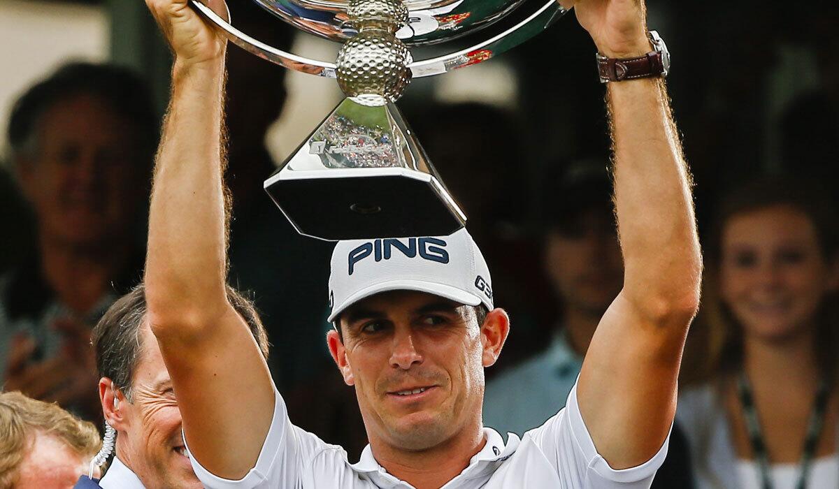 Billy Horschel lifts the FedEx Cup after winning the PGA tour championship Sept. 14 in Atlanta.