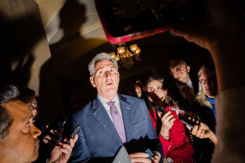 WASHINGTON, DC - APRIL 19: Speaker of the House Kevin McCarthy (R-CA) is surrounded by reporters after he leaves the House Floor to return to his office at the U.S. Capitol on Wednesday, April 19, 2023 in Washington, DC. McCarthy delivered remarks on the House floor, accounting the GOP's debt limit bill, which they call the Limit, Save, Grow Act. (Kent Nishimura / Los Angeles Times)