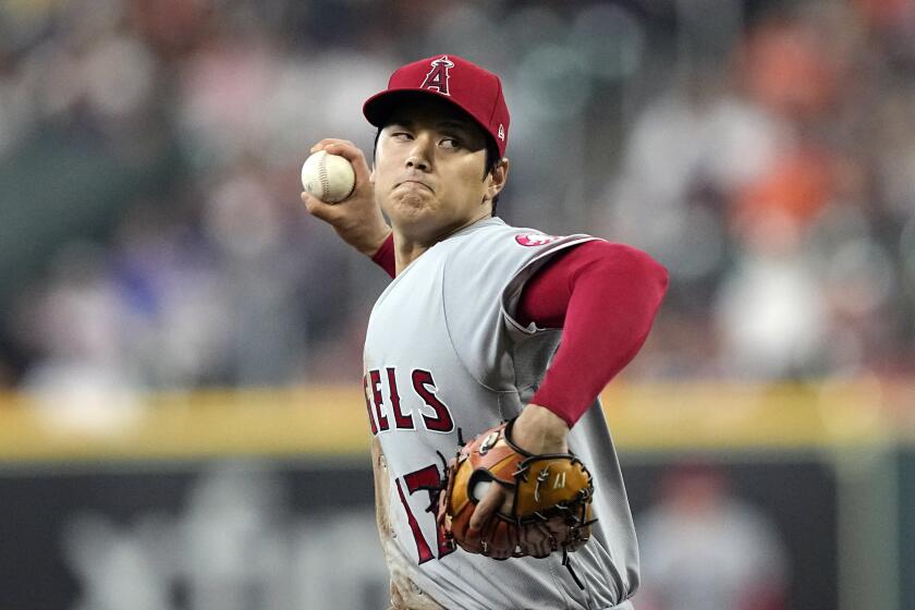 Los Angeles Angels starting pitcher Shohei Ohtani throws against the Houston Astros during the first inning of baseball game Wednesday, April 20, 2022, in Houston. (AP Photo/David J. Phillip)