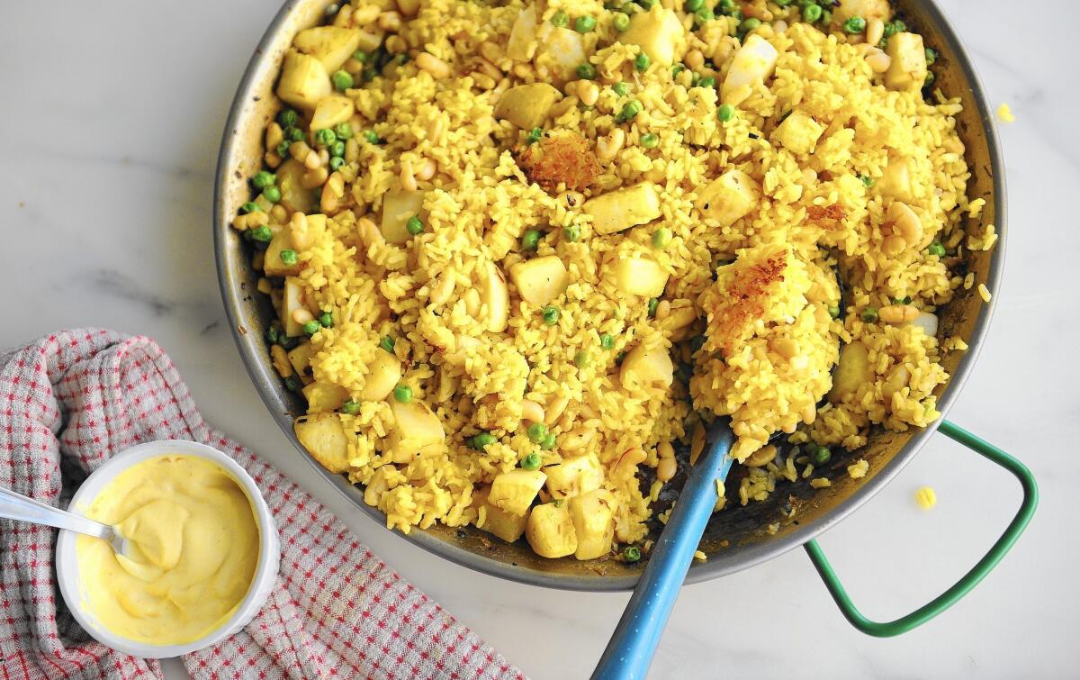 Recipe: Paella with turnips, peas and spring onions.