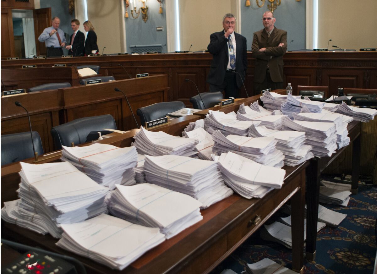 Stacks of paperwork await members of the House Agriculture Committee on Capitol Hill in Washington as it meets to consider proposals to the 2013 Farm Bill.