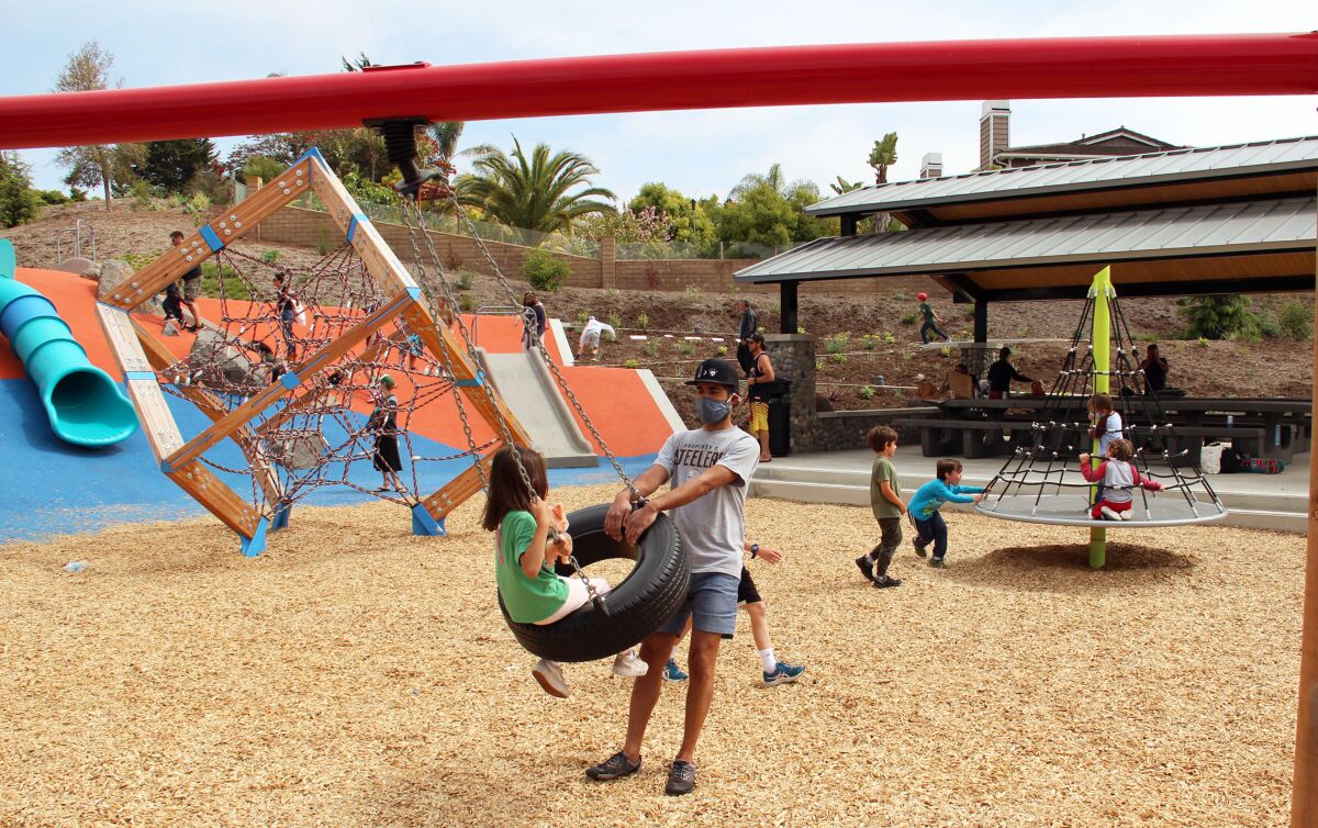 Testing out the new swings at Olympus Park.