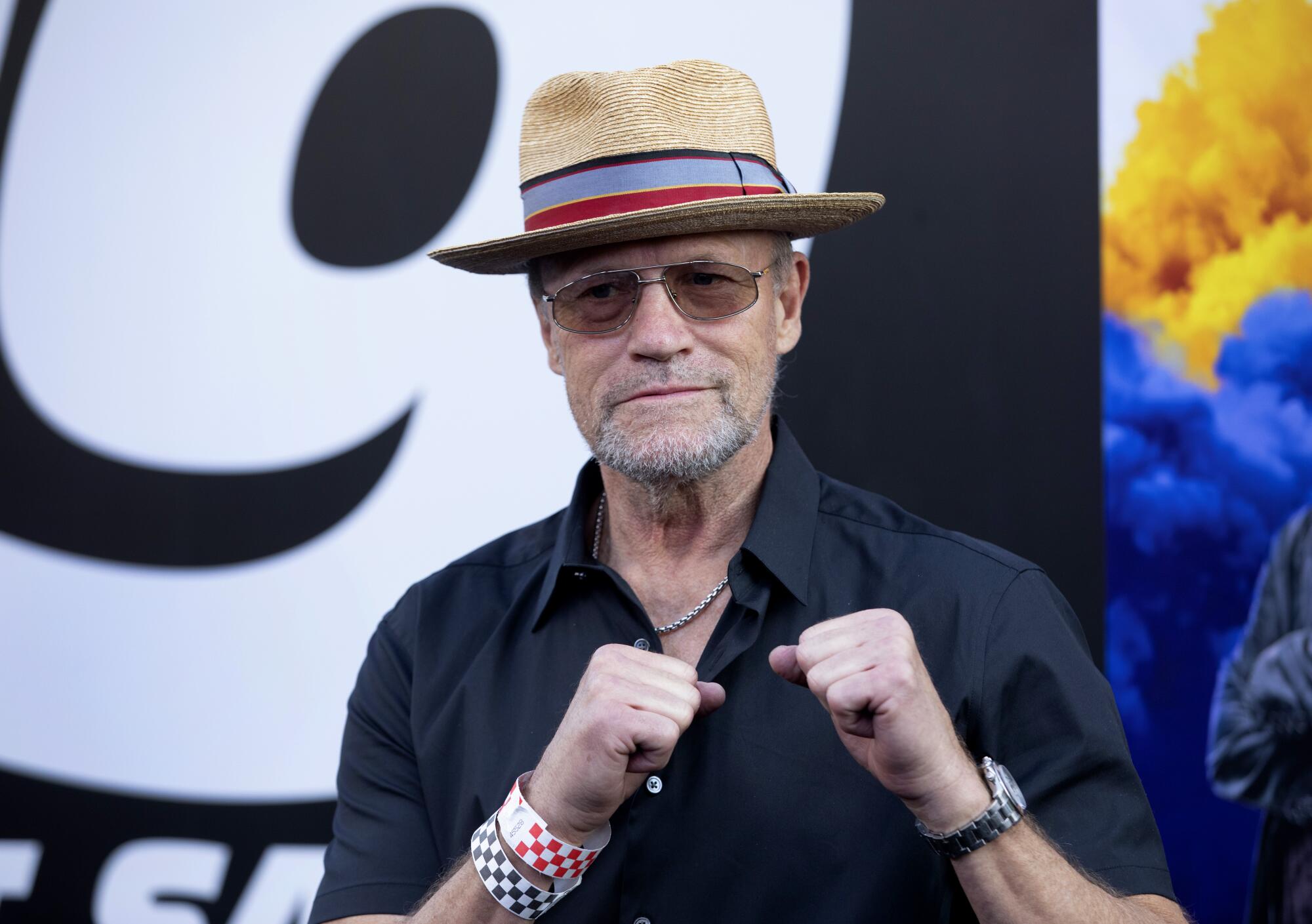 Unmasked Michael Rooker puts his fists up