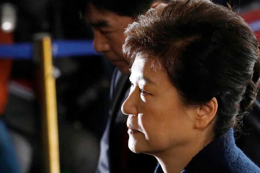 FILE - In this March 21, 2017 file photo, South Korea's ousted leader Park Geun-hye arrives at the prosecutor's office in Seoul, South Korea. Media reports say that South Korean prosecutors have decided to ask a court issue a warrant to arrest former President Park on corruption allegations. Yonhap news agency reported Monday, March 27 2017, that prosecutors reached the decision after they grilled Park last week over suspicions she colluded with a jailed confidante to extort from companies and allowed the friend to secretly interfere with state affairs (Kim Hong-ji/Pool Photo via AP, File)